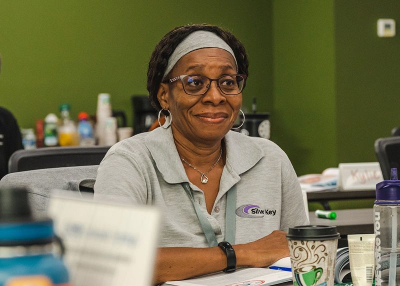 Black woman learning in a NAMI classroom